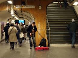 A musician playing in the metro. We tried to do that but the police always chased us away. Apparently you needed a license to do that.